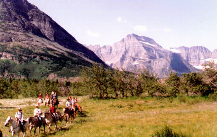 Horseback riders in mountains on east side of Glacier National Park