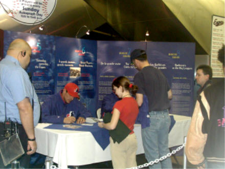Expos players signing autographs before the game