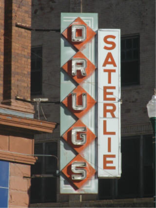 Drugstore sign, downtown Mitchell