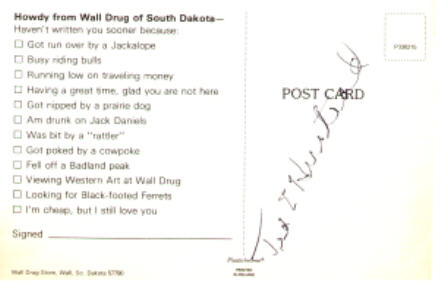 Ted Hustead autograph on a Wall Drug postcard, 1991